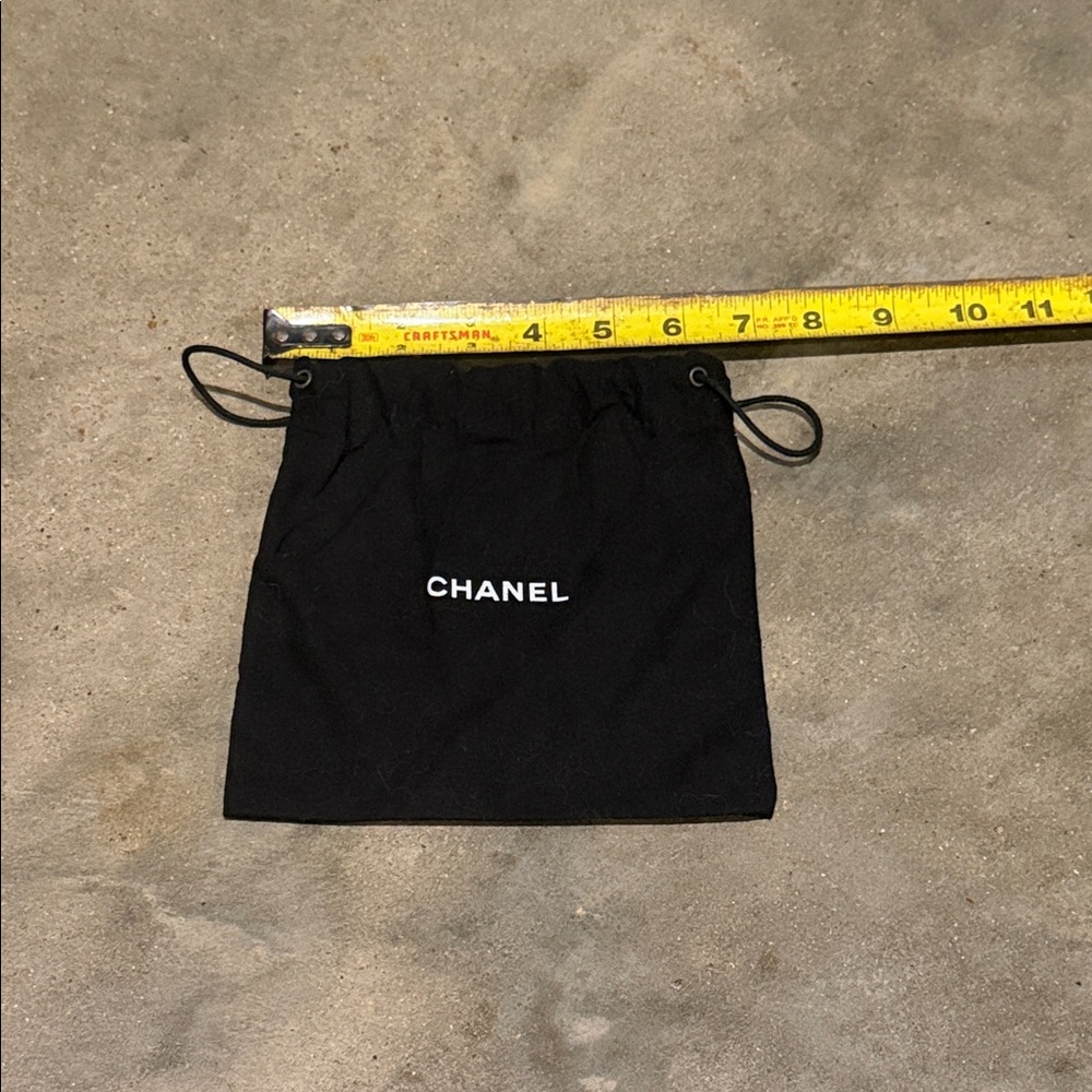 Authentic CHANEL Black Drawstring Pouch with White Logo